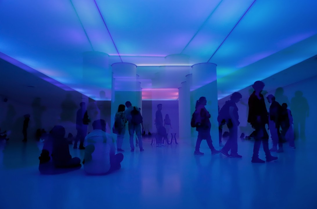 Visitors in a blue and violet light installation at the Centro de Cultura Digital